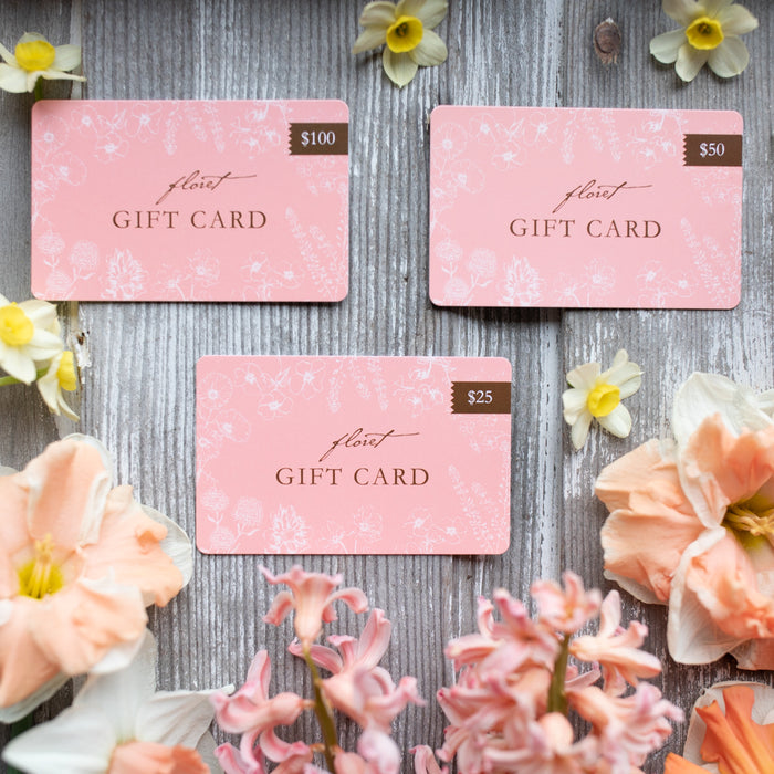 An overhead of Floret's gift cards, multiple increments including Floret's graphic
